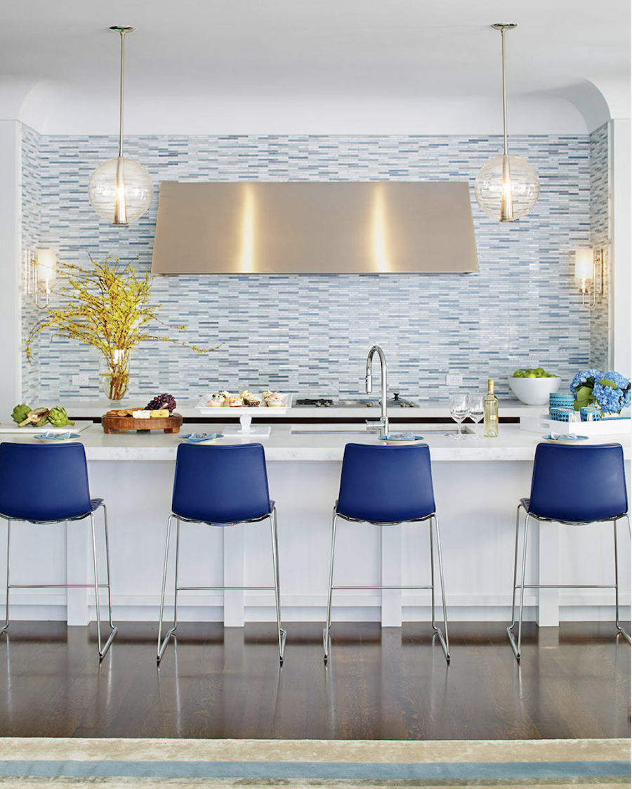 blue chairs in a modern kitchen with blue tile backsplash