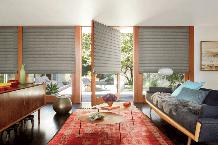 Rotating doors featuring Hunter Douglas shades.