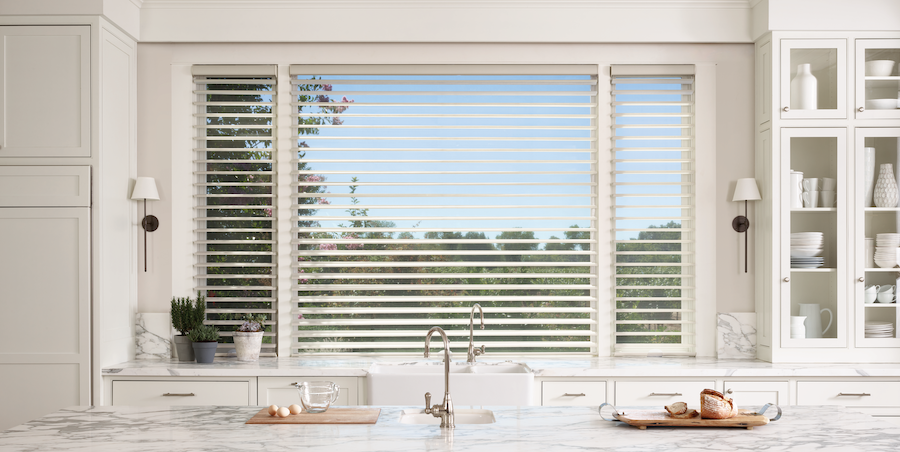 White silhouette shades above kitchen sink.