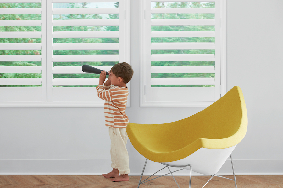 white plantation shutters in playroom for child safety in Minneapolis MN