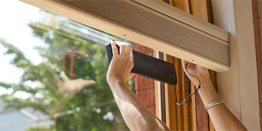 Window-mounted solar charger for Hunter Douglas rechargeable battery wand