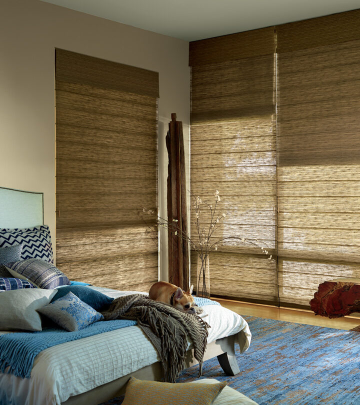 bedroom with tall windows covered with dual roman shades in Burnsville MN