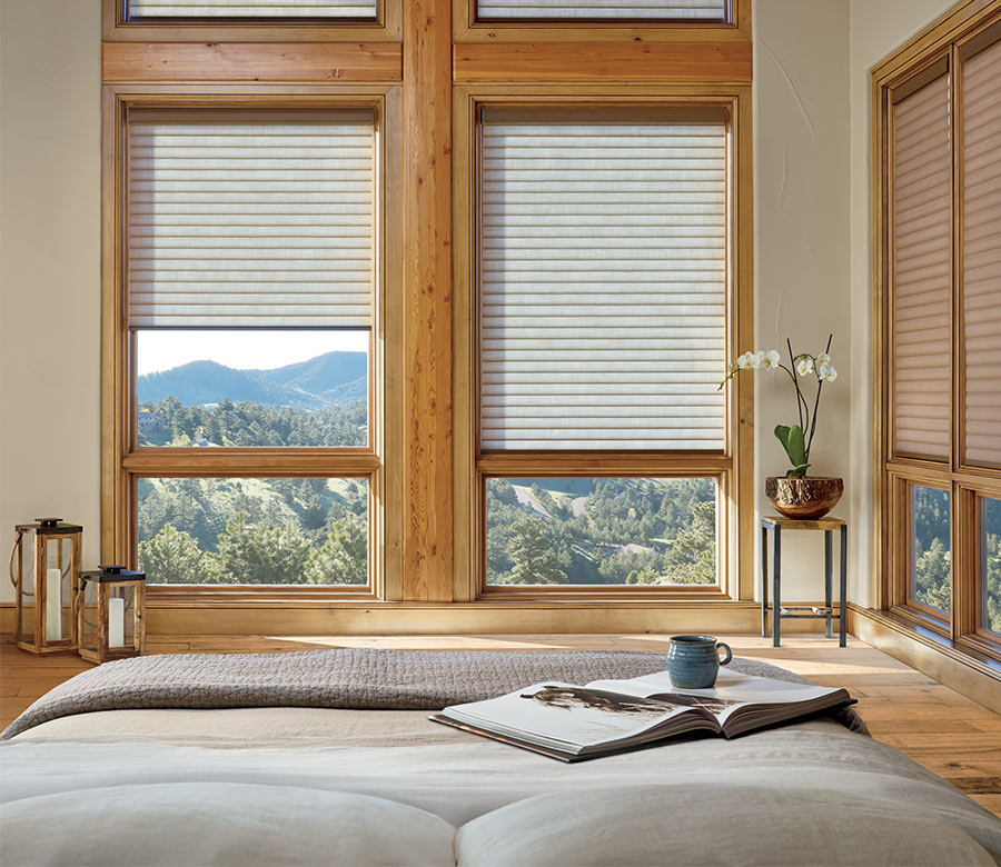 bedroom with hard to reach windows covered with honeycomb roller shades in Maple Grove MN