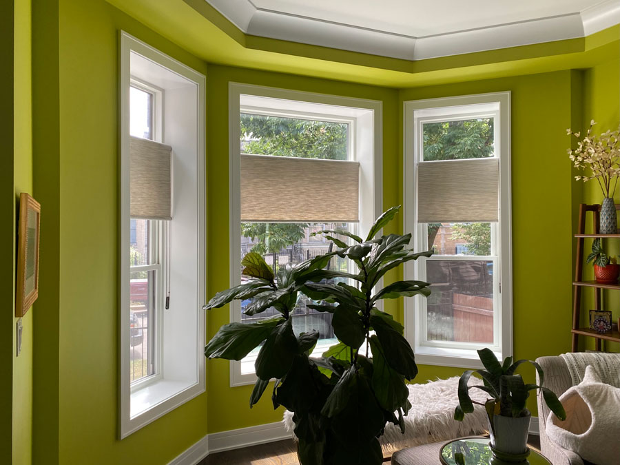 a tricky bay window covered with inside mount shades in st paul home