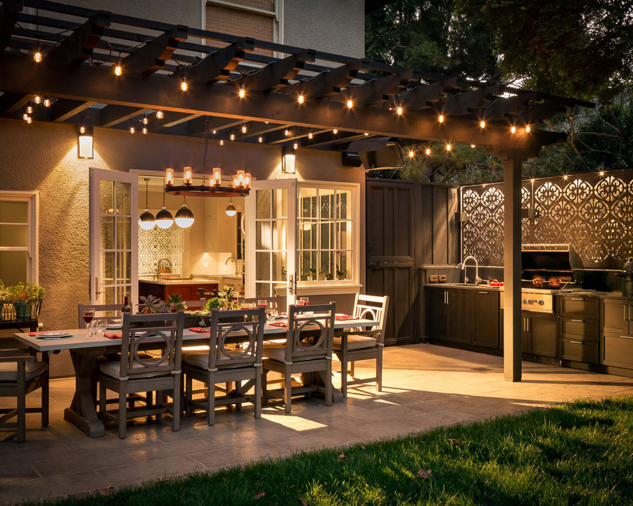 Backyard patio with dining table and string lights