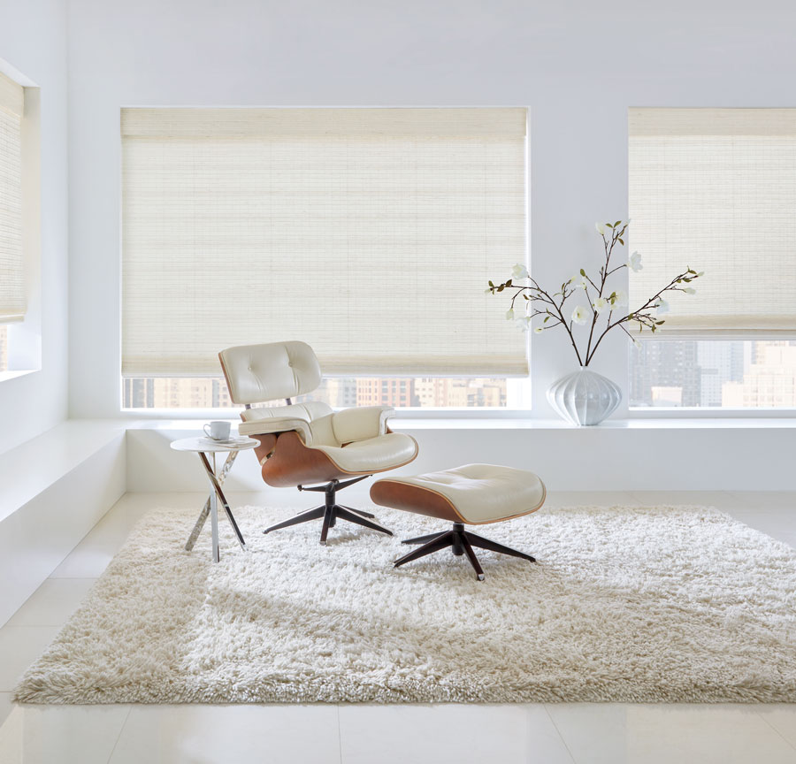 White woven shades on large windows