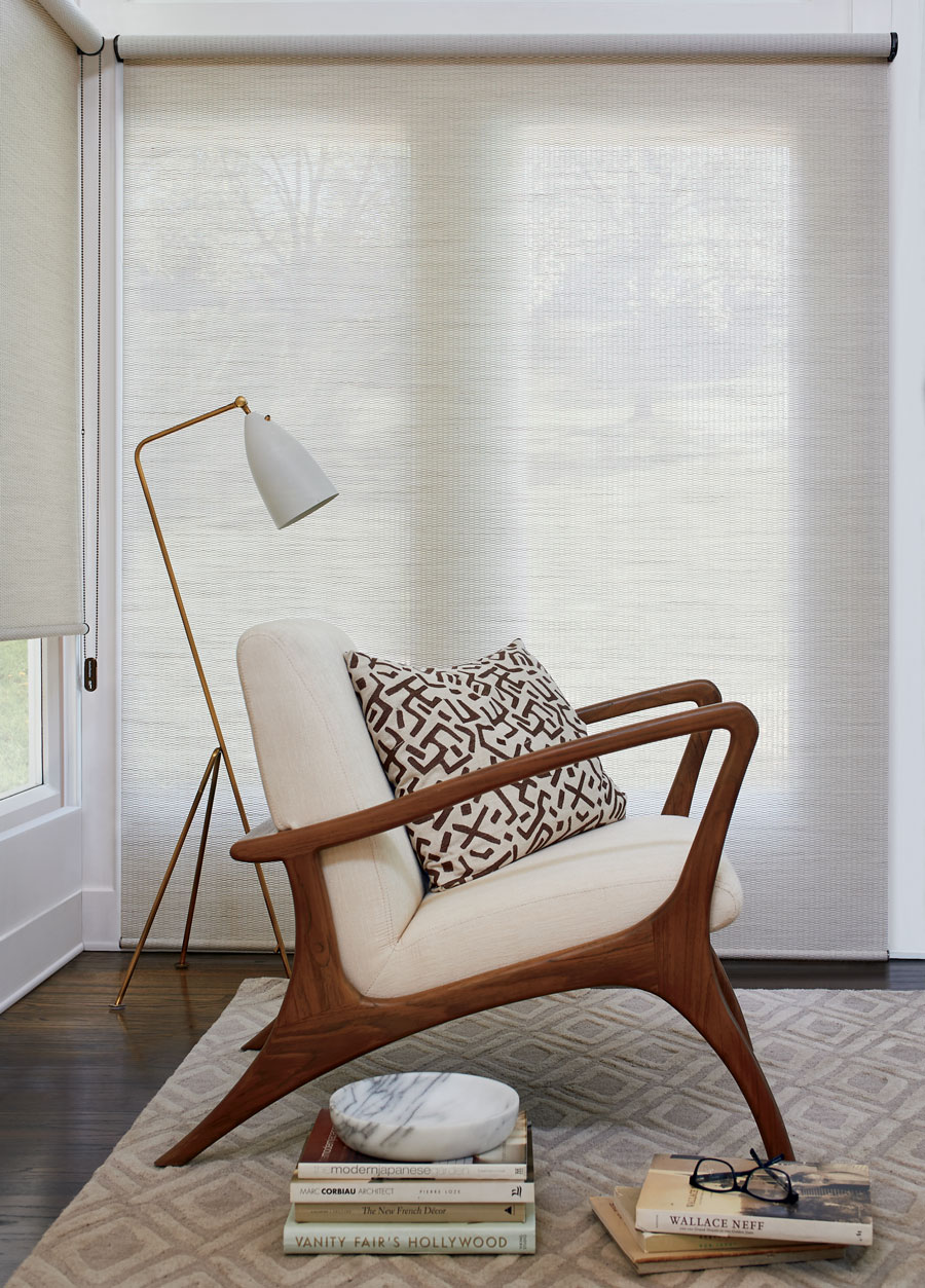 Soft white roller shades in living room