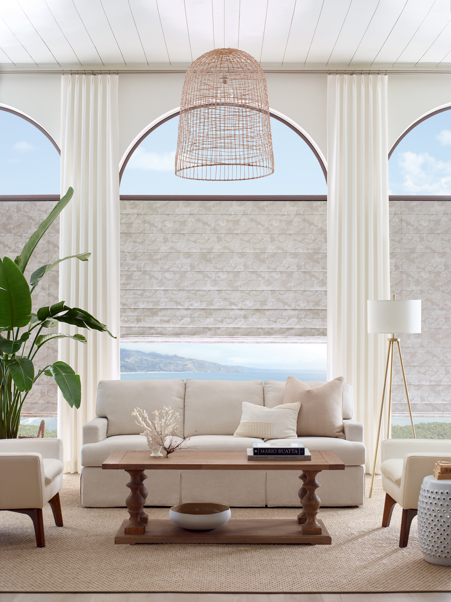 beige roman shades with white side draperies in a contemporary casual living room in Little Canada, MN