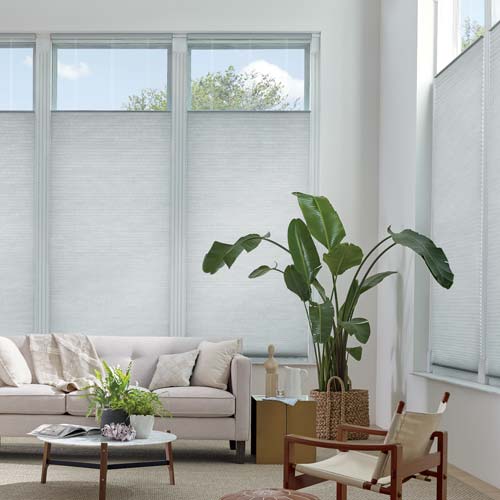 light gray shades on living room windows with top down