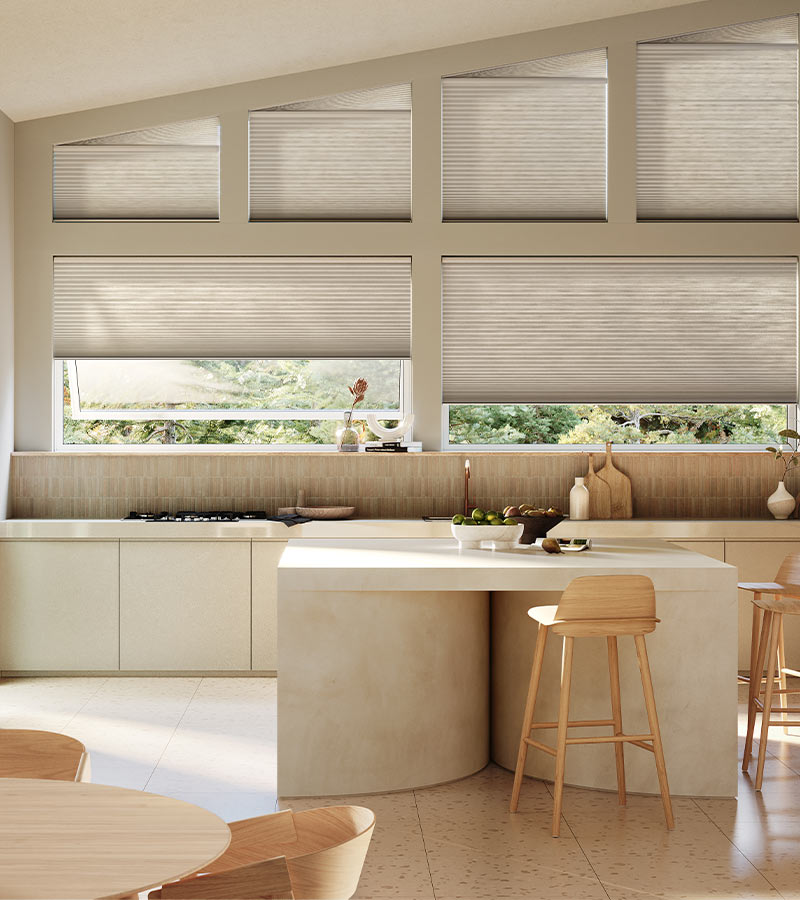 angled windows in contemporary kitchen space cellular shades in beige color