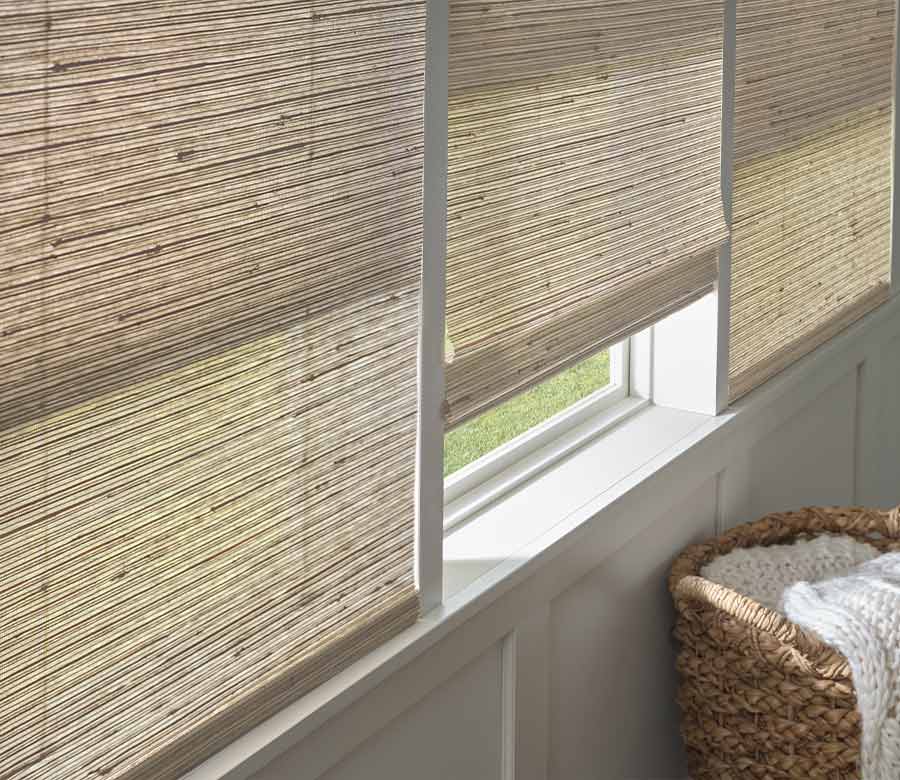 Bedroom with neutral woven blinds