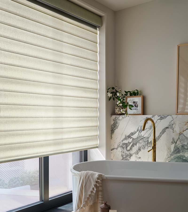 large-windows-bathroom-pirouette-hunter-douglas-custom-window-shades-blinds-aero-drapery-and-blind bathroom with white pirouette shades and white soaking tub