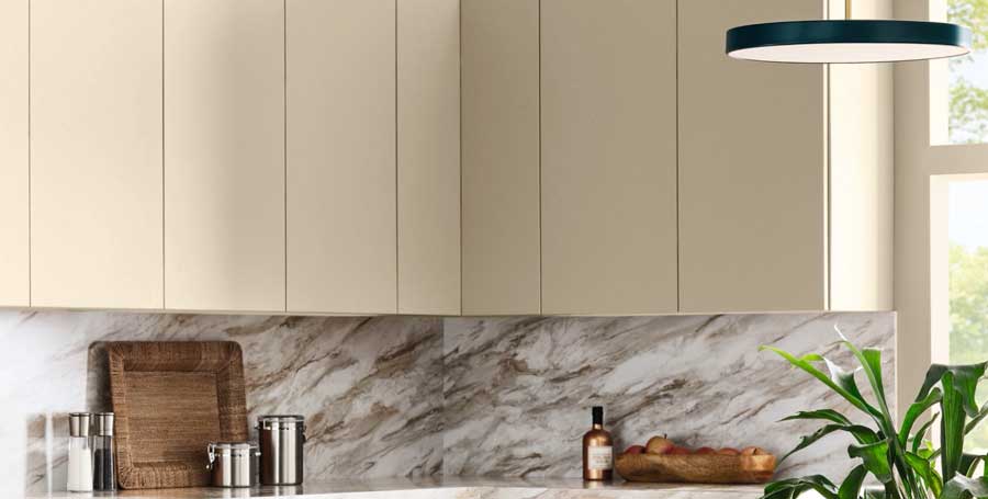 universal kahki cupboards in a kitchen with marble backsplash