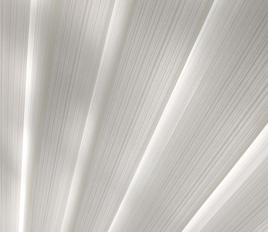 close up detail of white sheer shades luminette aero drapery and blind