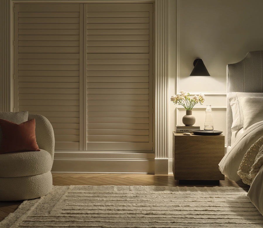 dark room with palm beach vinyl shutters in bedroom