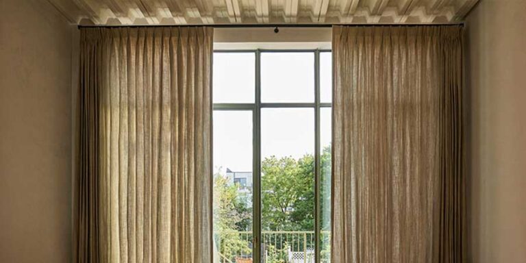 pinch pleat drapery on either side of windows
