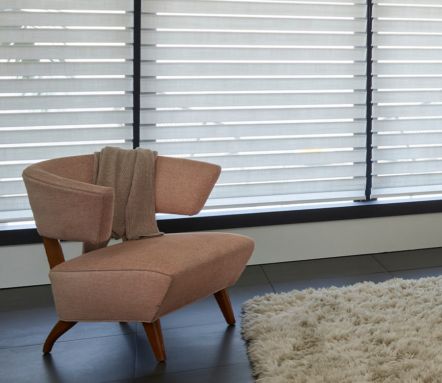 Silhouette® sheer shades filtering light through black-trimmed windows