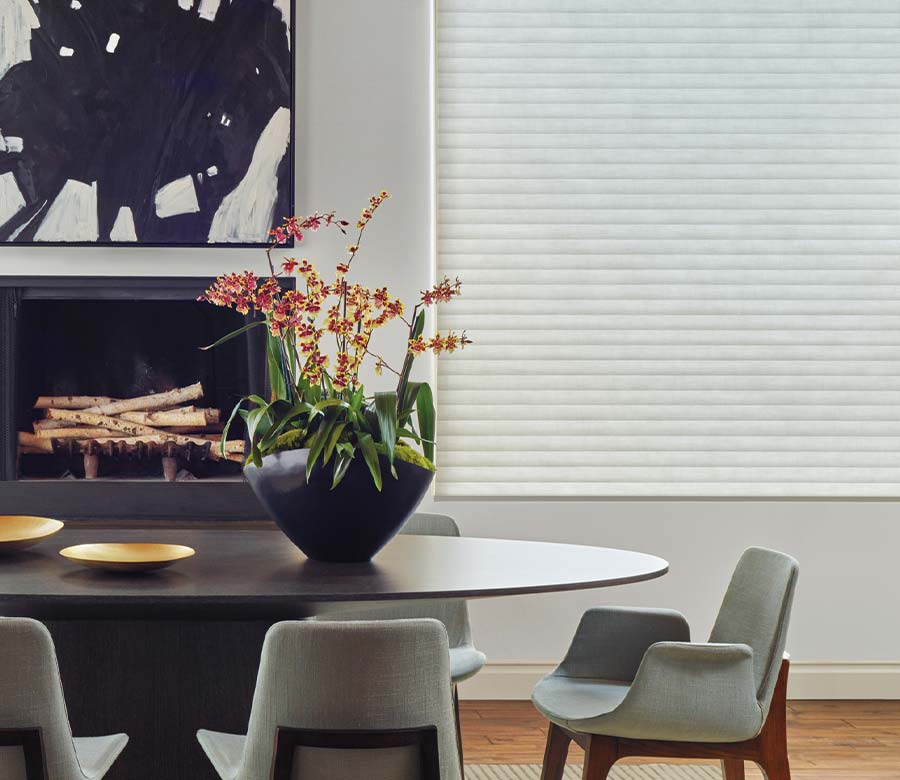 Modern dining room with a white cellular window shade