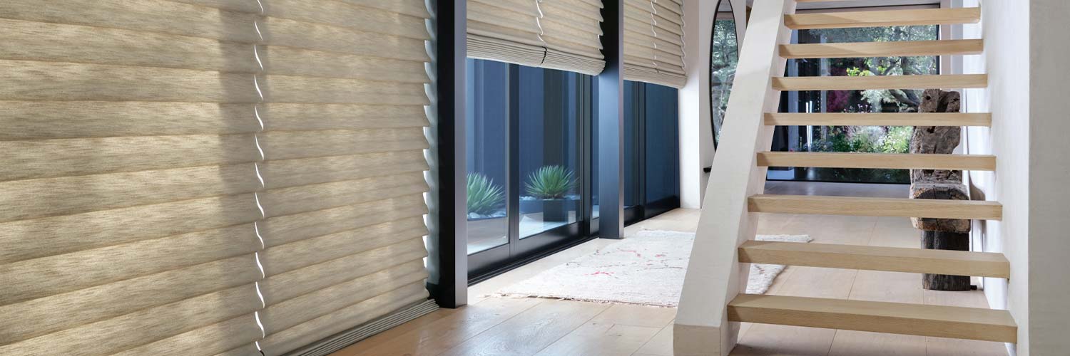 Roman shades on hallway windows and sliding glass doors